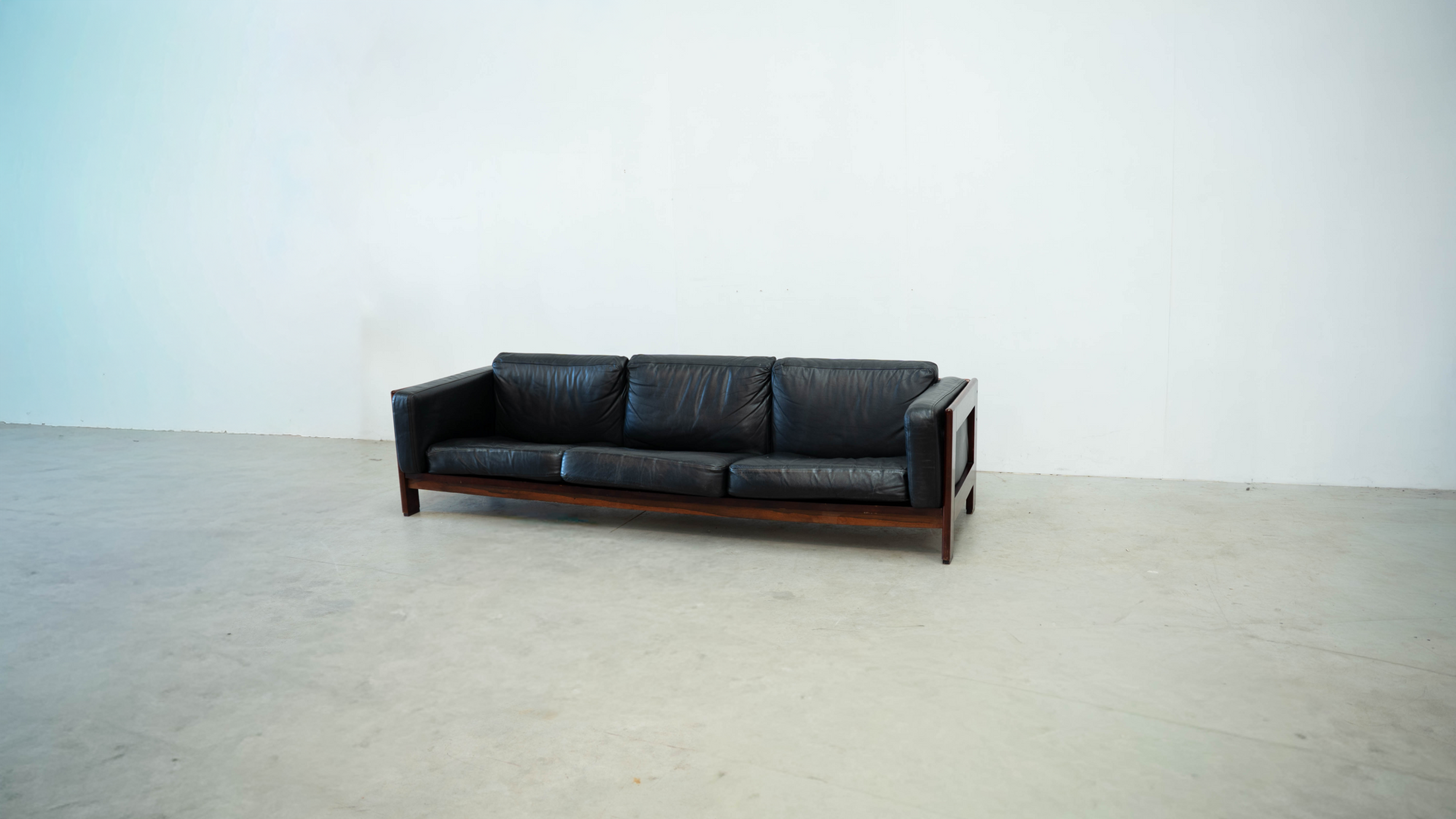 Italian leather and rosewood sofa