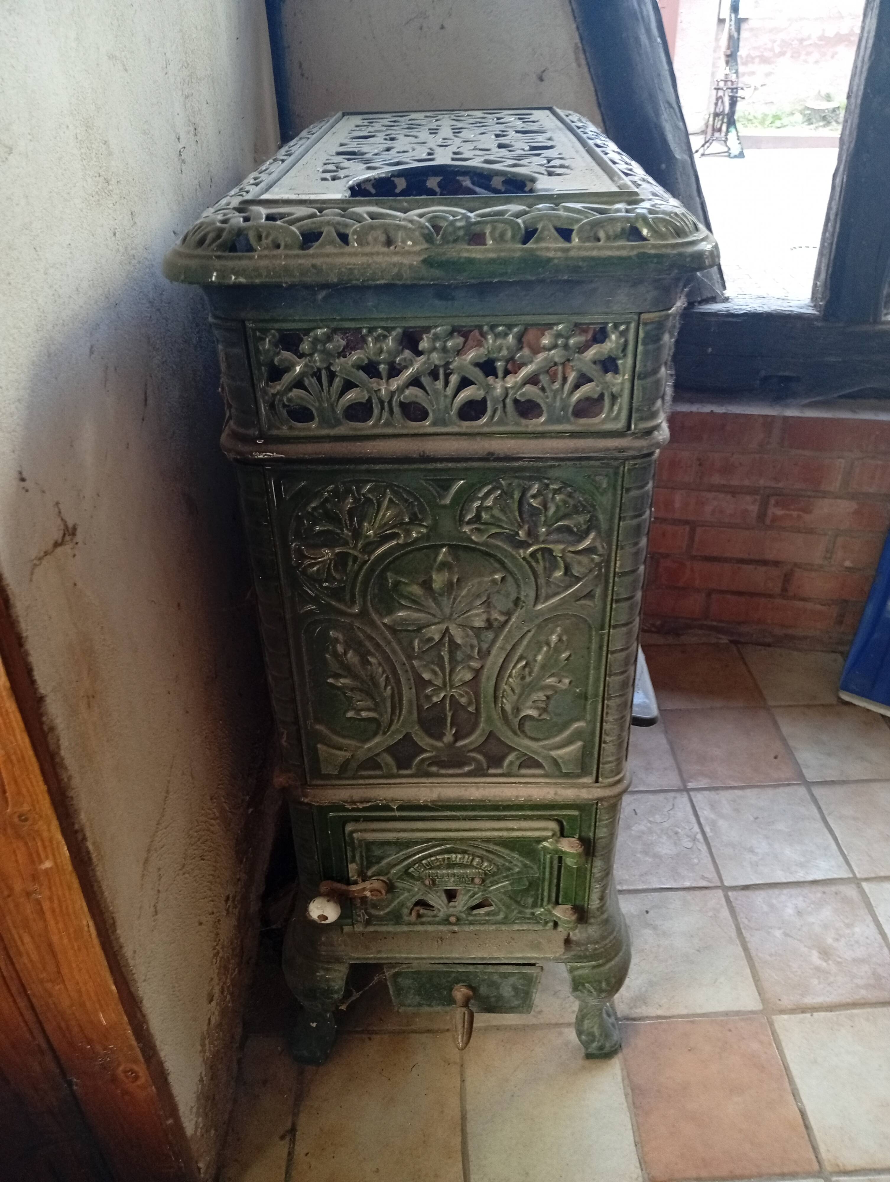Old green enamelled cast iron pan