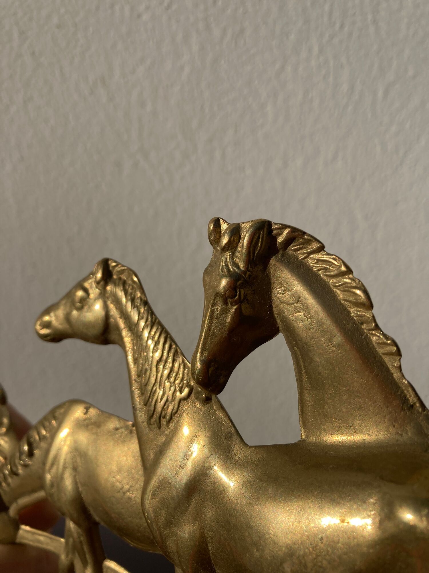 Hook for keys or tea towels in gilded brass with carved horse decoration