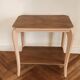 Side table with curved pink legs