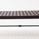 Solid wood coffee table with an openwork design and wrought iron legs.
