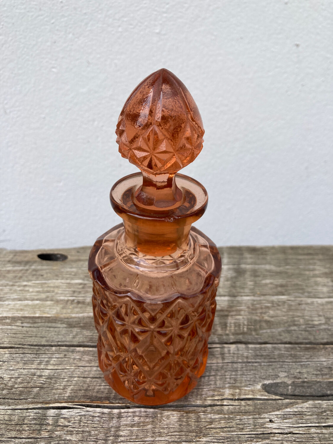 Art Deco perfume bottle in old amber pink glass