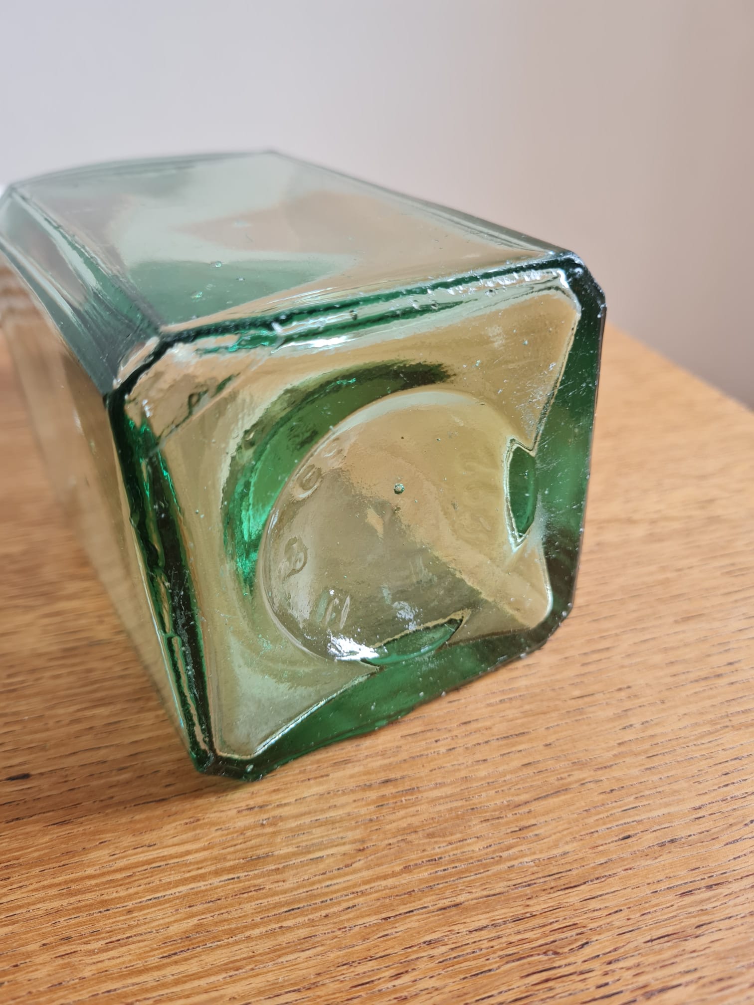 Green blown glass bottle