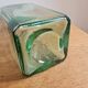 Green blown glass bottle