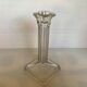 Four old square glass moulded candlesticks.