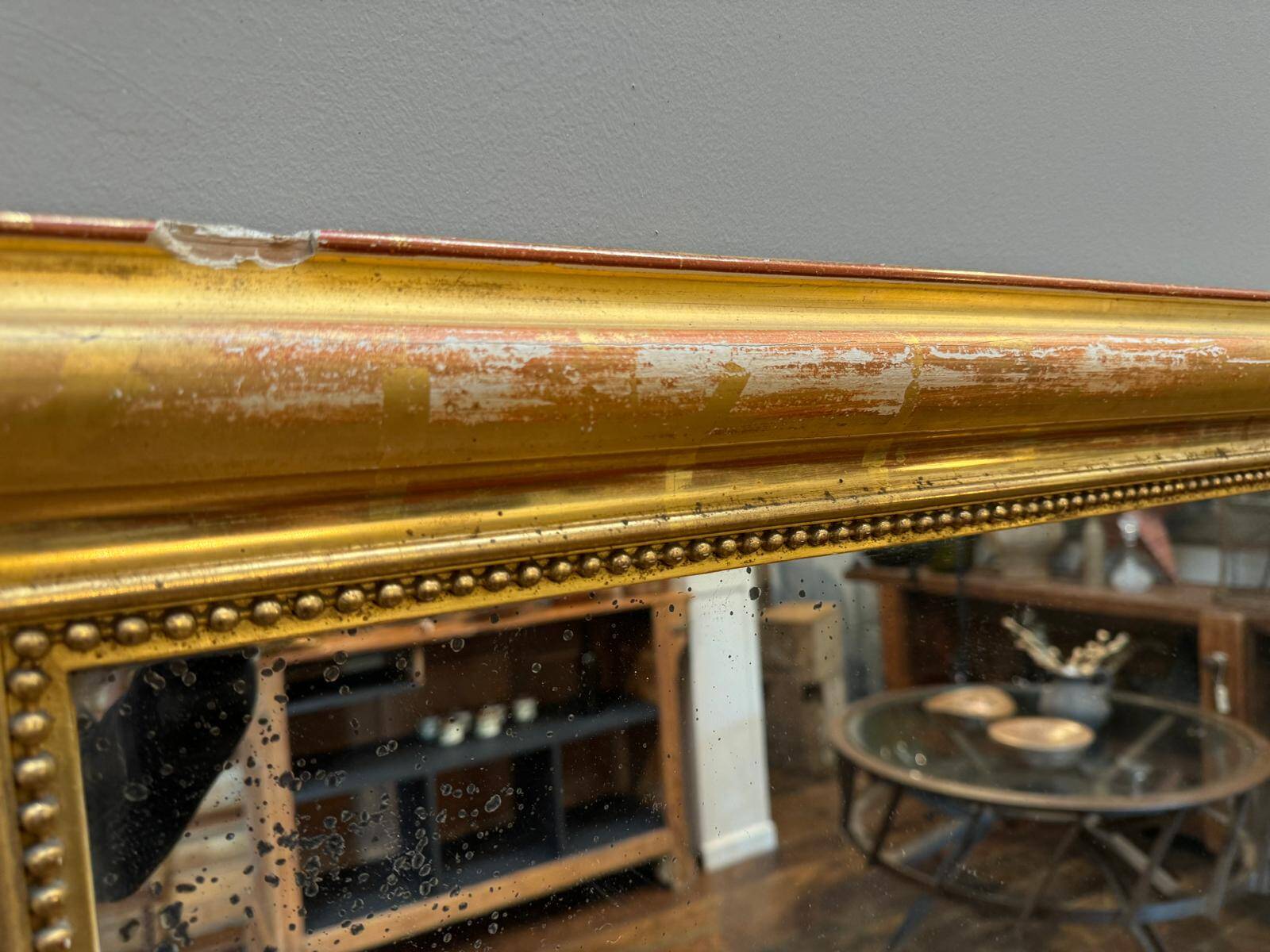 Antique gilded fireplace mirror