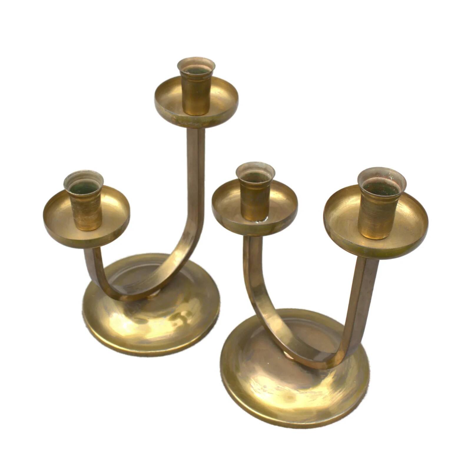 A beautiful pair of antique French Art Deco brass candlesticks