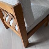 Vintage wooden armchair with curly seat