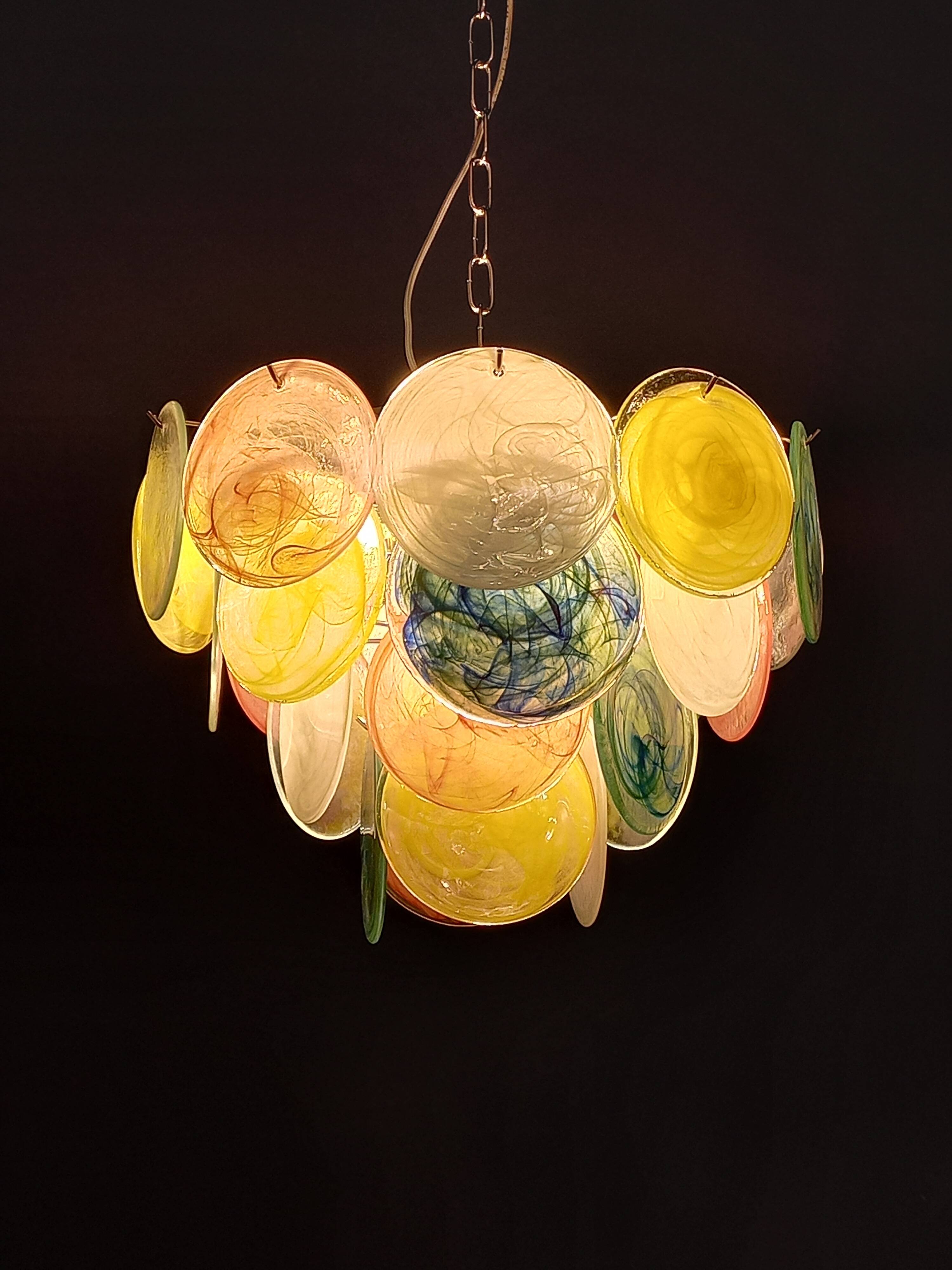 Handcrafted chandelier with Murano glass discs.
