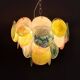 Handcrafted chandelier with Murano glass discs.