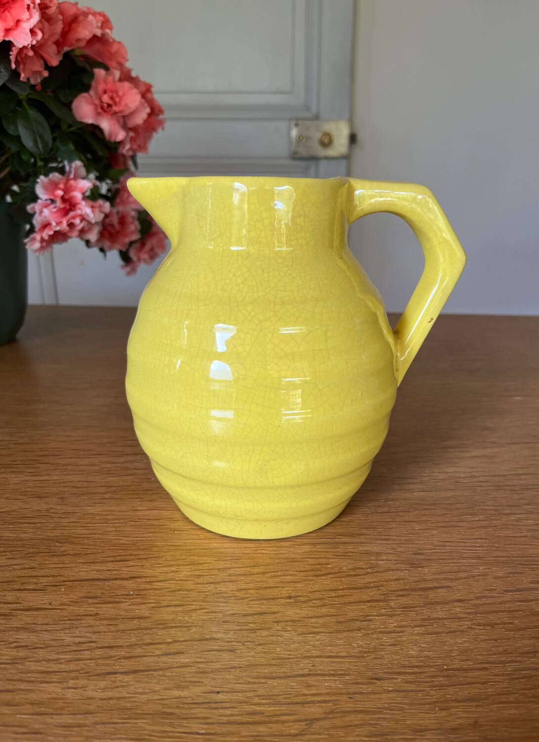 Old yellow ceramic pitcher