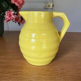 Old yellow ceramic pitcher