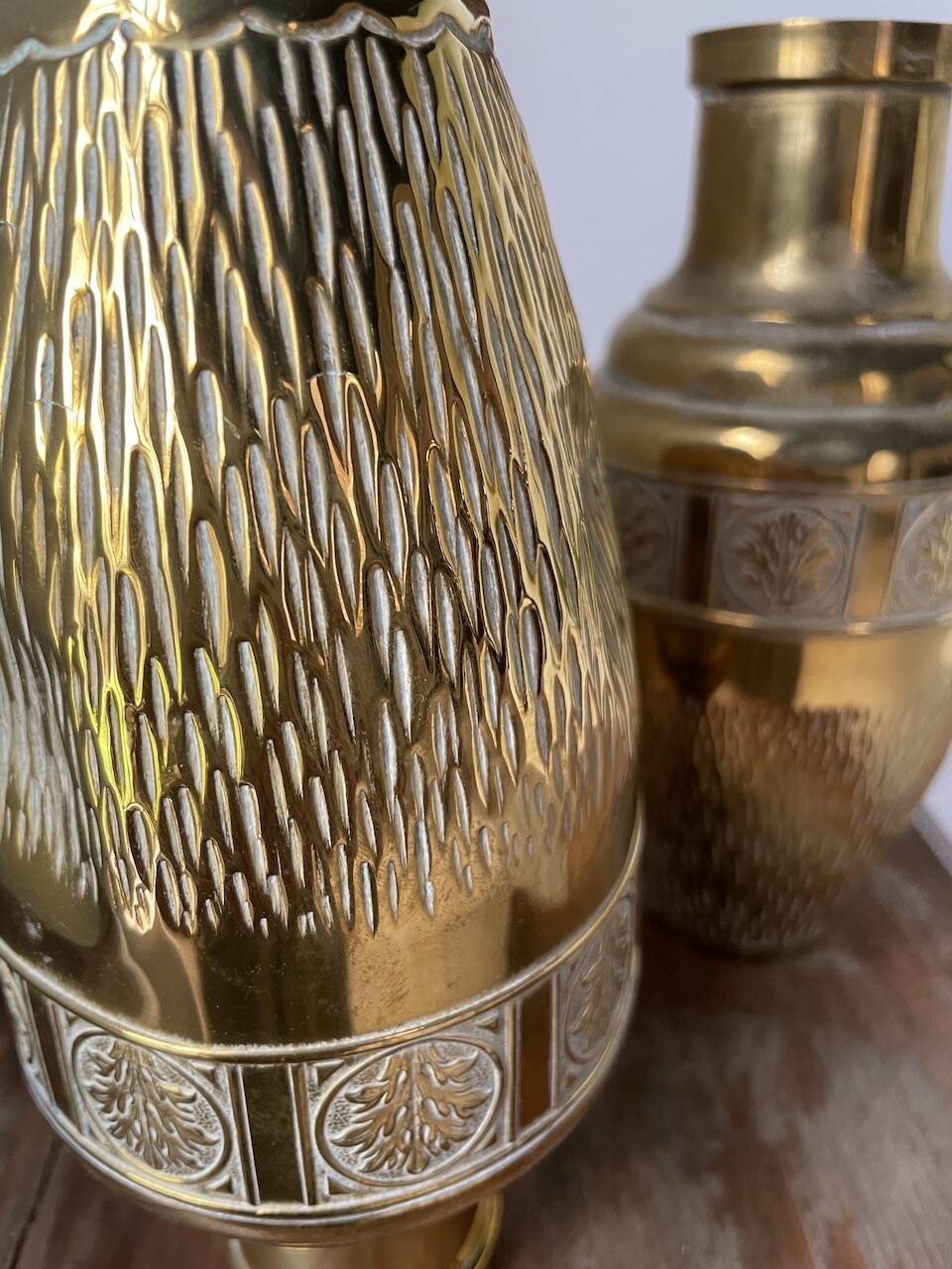Duo of embossed brass vases