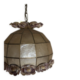 Vintage pendant light with a pearlescent shade and floral decoration.