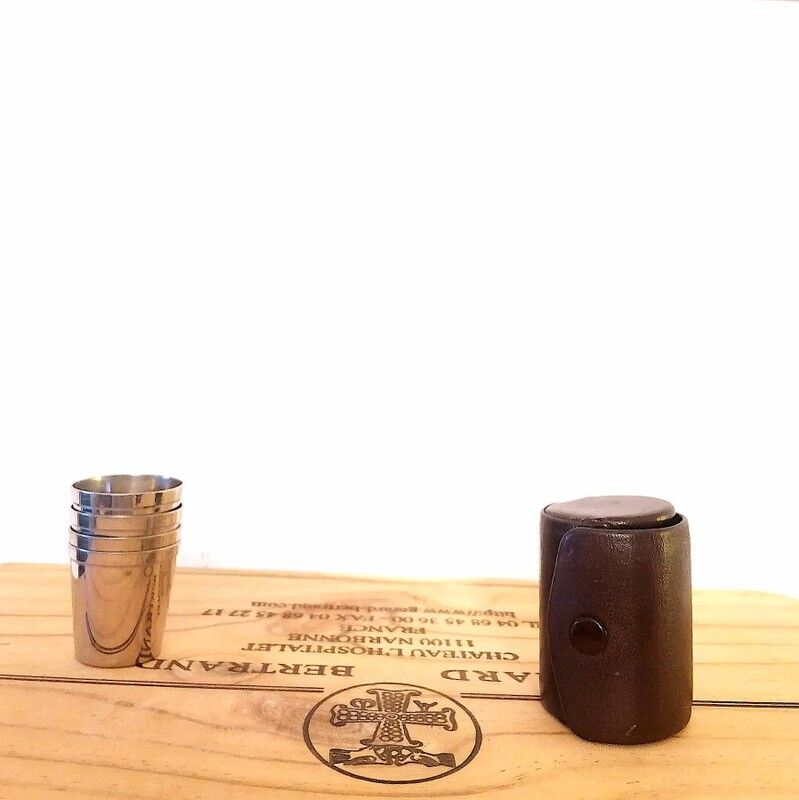 Liquor service in its leather case