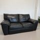 Two-seater black leather sofa — postmodern design