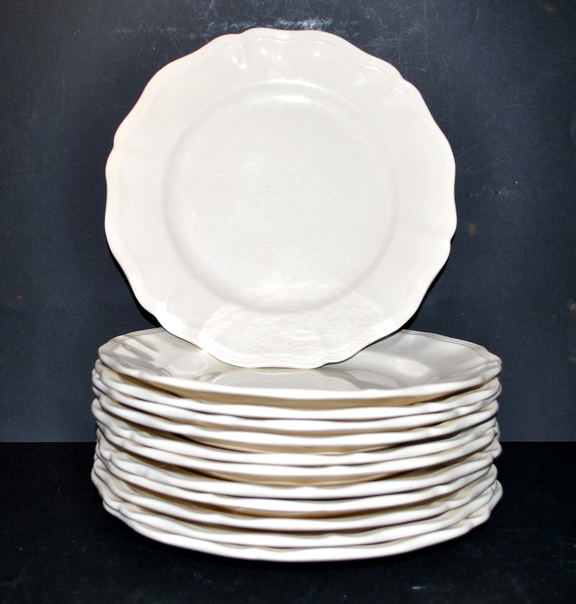 Sarreguemines series of 12 flat plates in opaque faience cream "terre de fer"