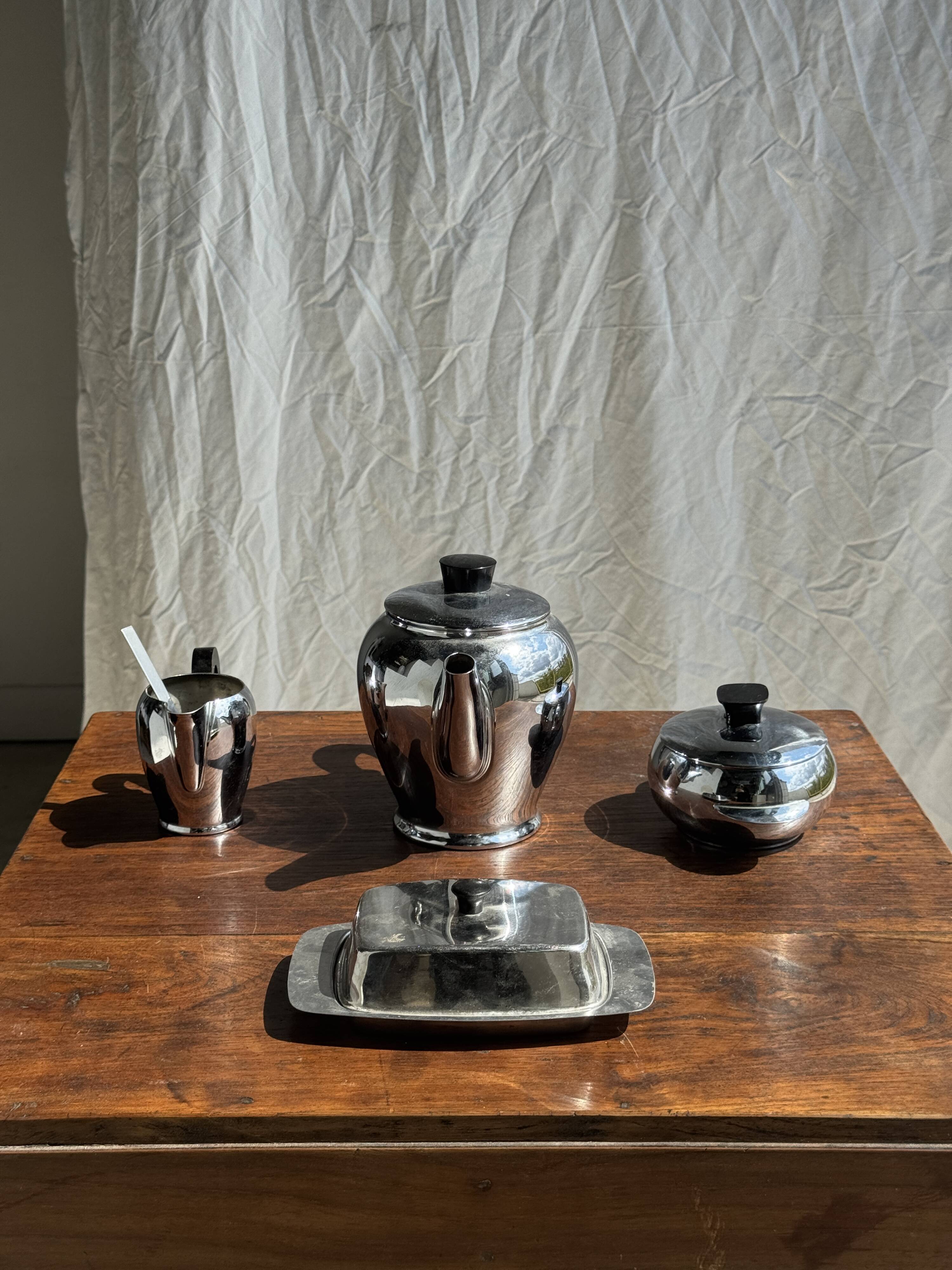 Tea set including teapot, milk jug, sugar bowl and butter dish