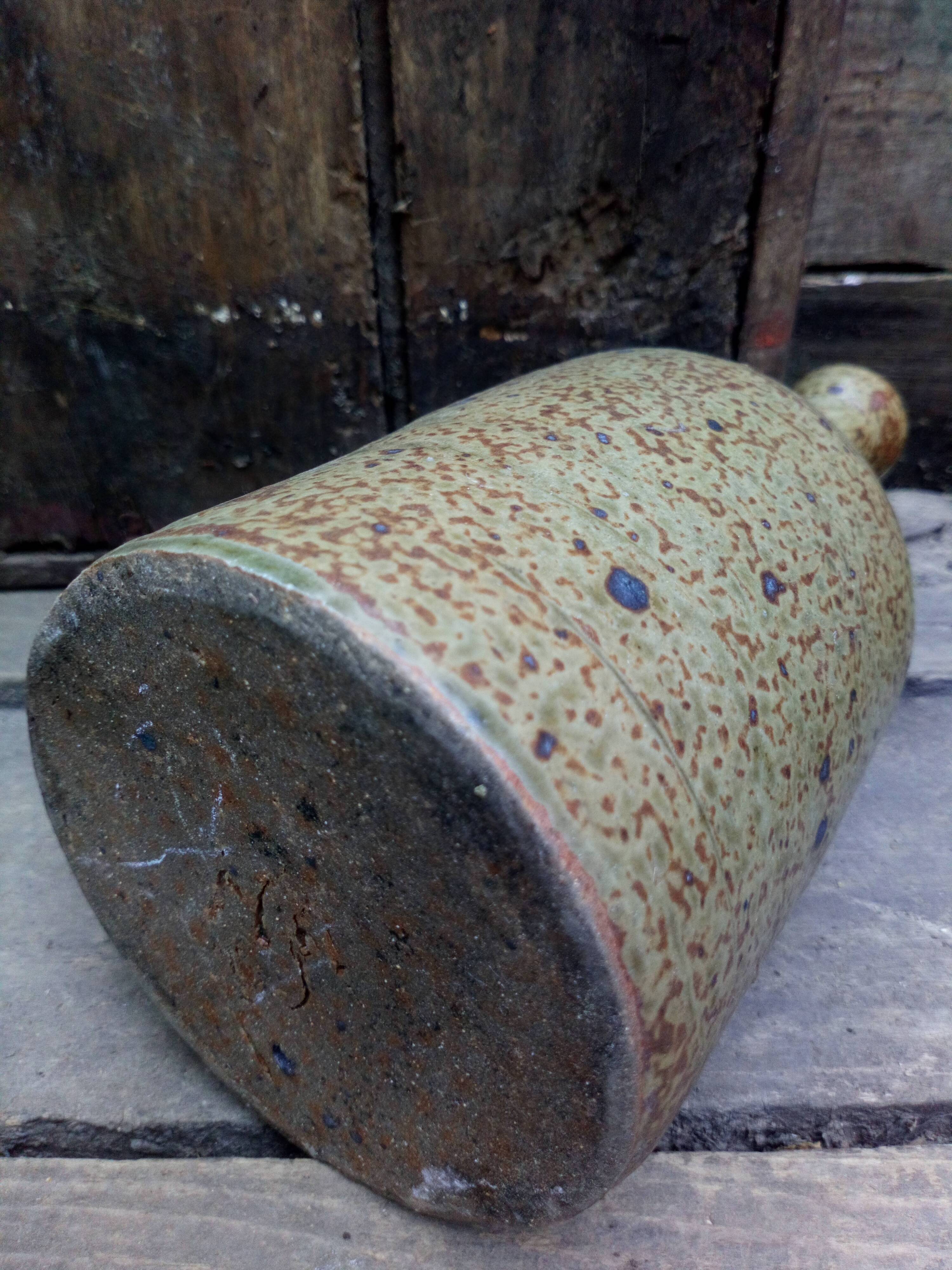 Bottled sandstone vase with a narrow neck