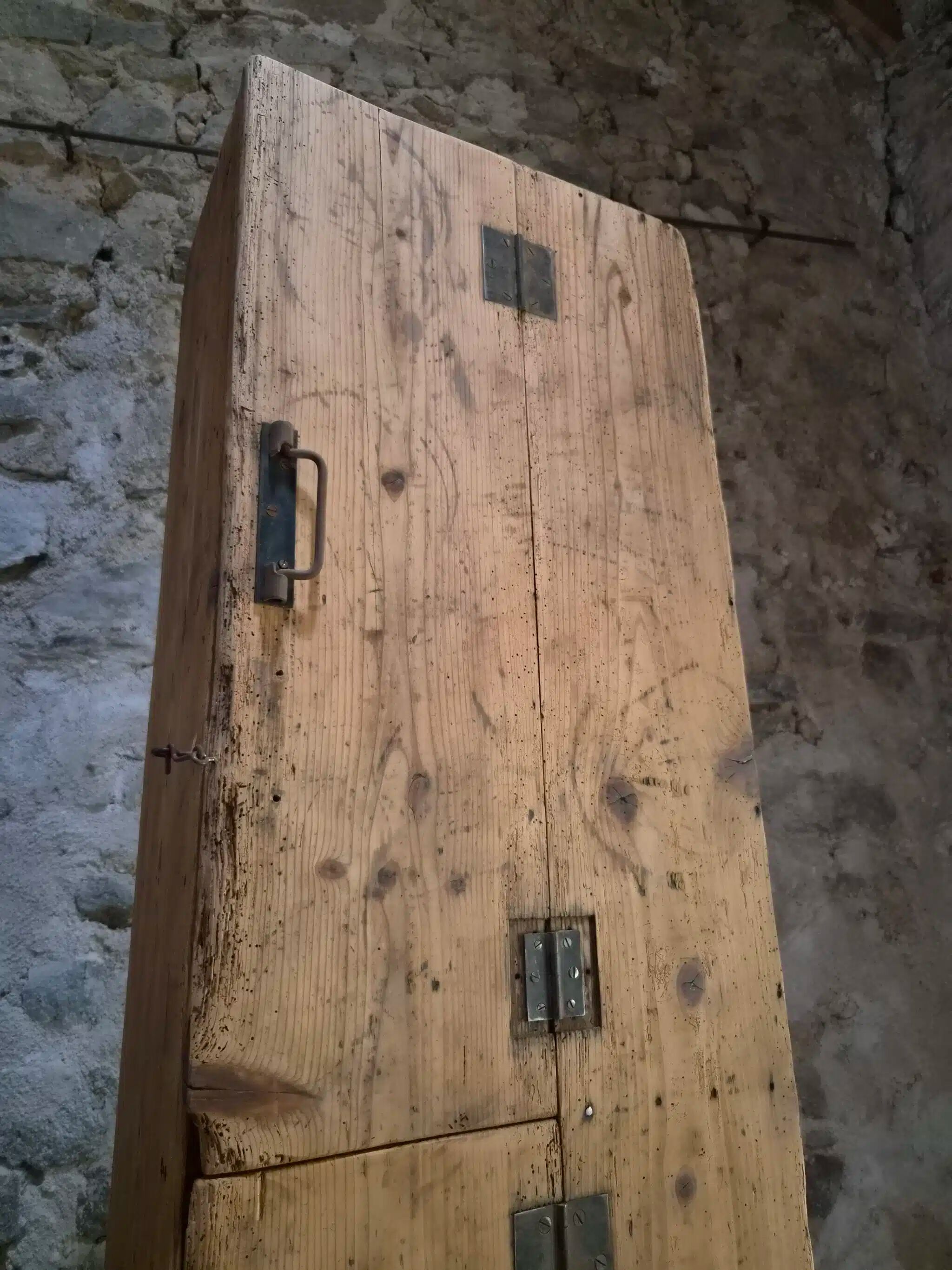 Antique French workshop cabinet in pine with compartments.