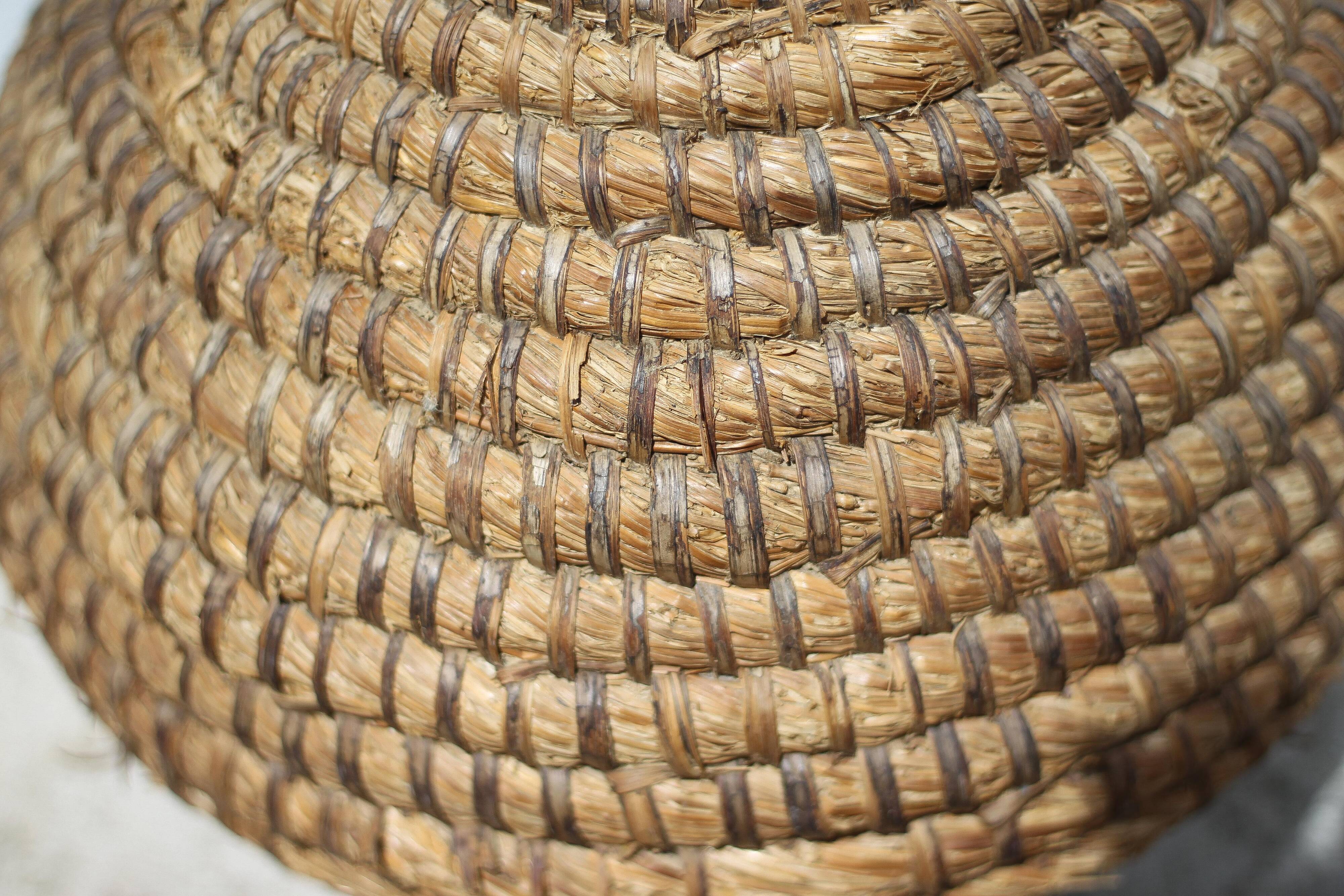 Old basket, burgundy straw and bramble, woven basket, interior decoration