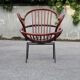 Rattan shell armchair with metal feet