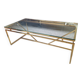 Coffee table in glass and gold metal