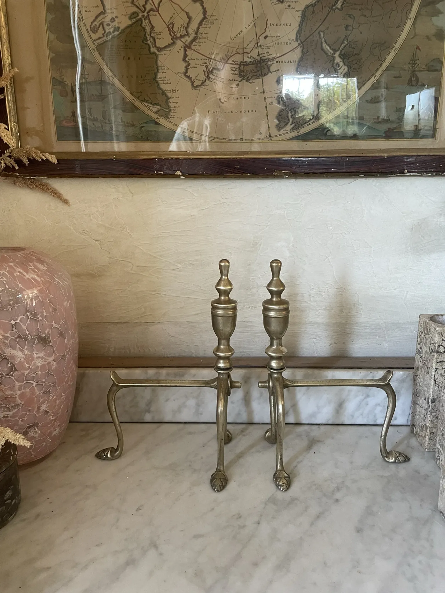 Pair of Victorian brass fire dogs from the late 19th century.