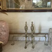 Pair of Victorian brass fire dogs from the late 19th century.
