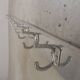Wall-mounted aluminium coat rack of 225 cm with 16 double hooks, 1960s.