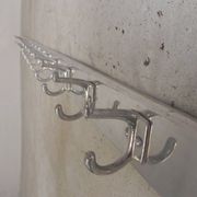 Wall-mounted aluminium coat rack of 225 cm with 16 double hooks, 1960s.