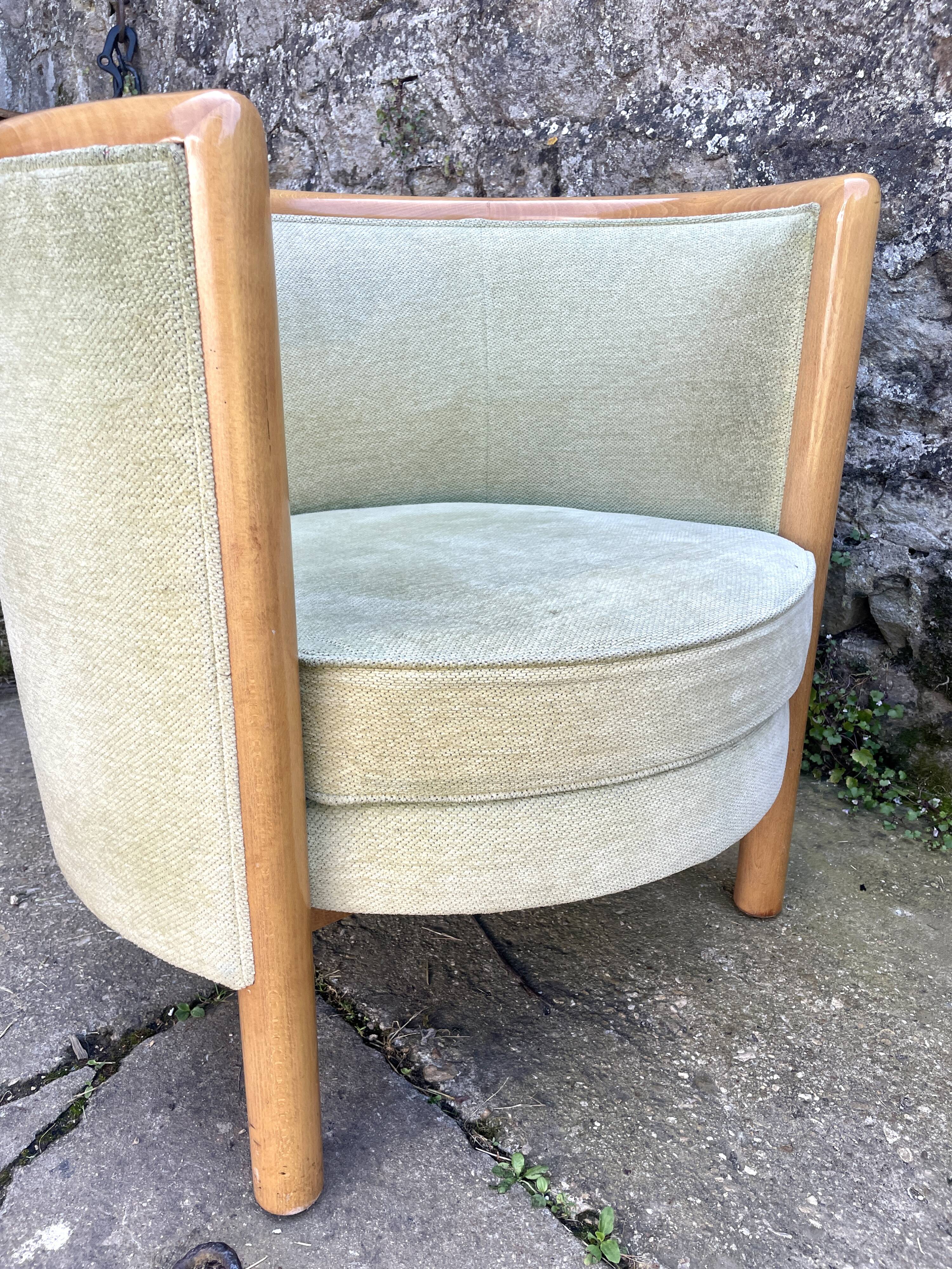 Pair of barrel-shaped armchairs in beech and almond green velvet by Maison Rosello