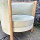 Pair of barrel-shaped armchairs in beech and almond green velvet by Maison Rosello