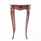 Table with a marble top, France, around 1910.