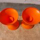 pair of orange tam-tam stools