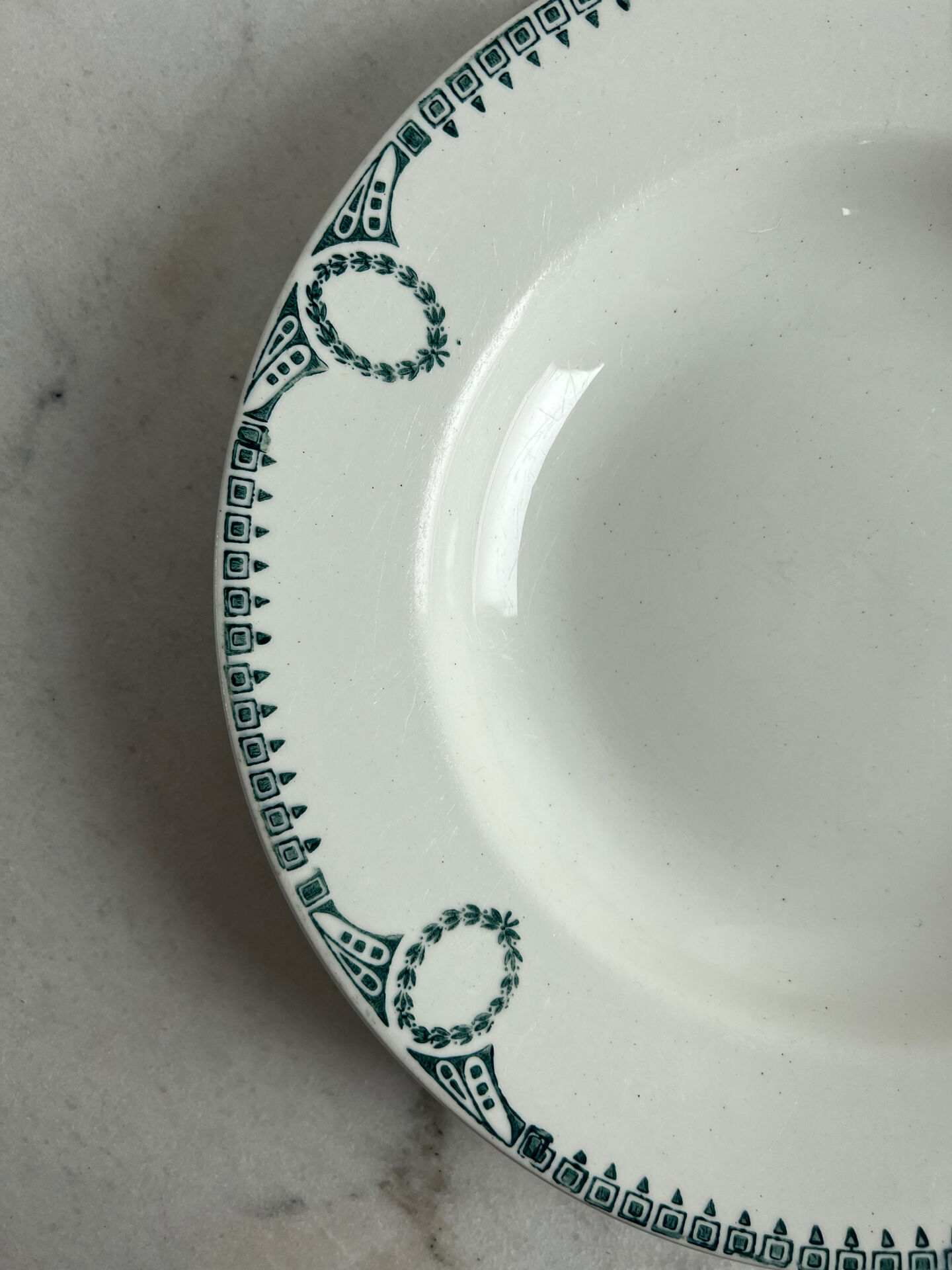 Set of 3 St Amand deep plates with green crown decoration.