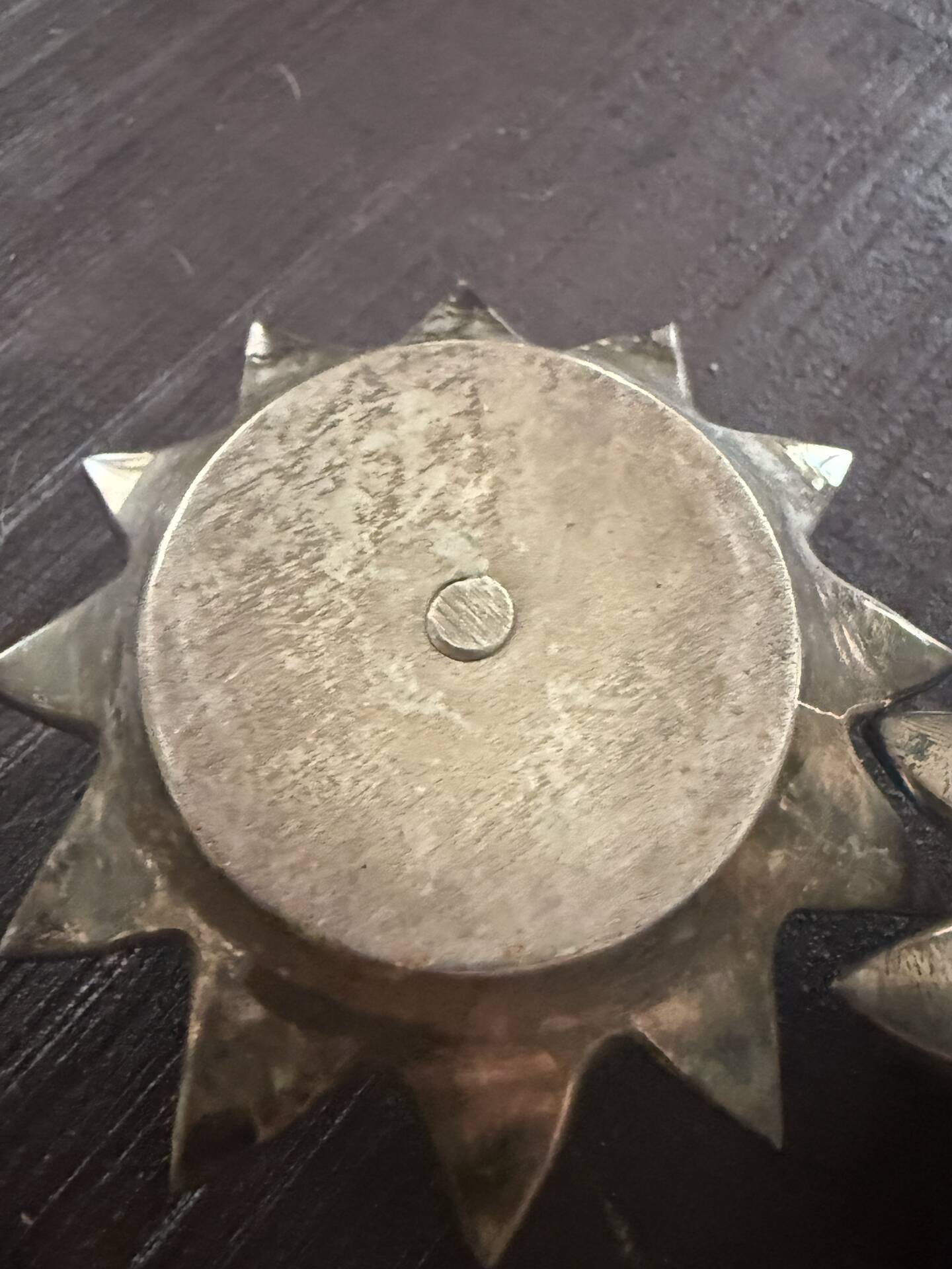 Pair of brass candle holders in the shape of a lotus flower.