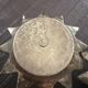 Pair of brass candle holders in the shape of a lotus flower.