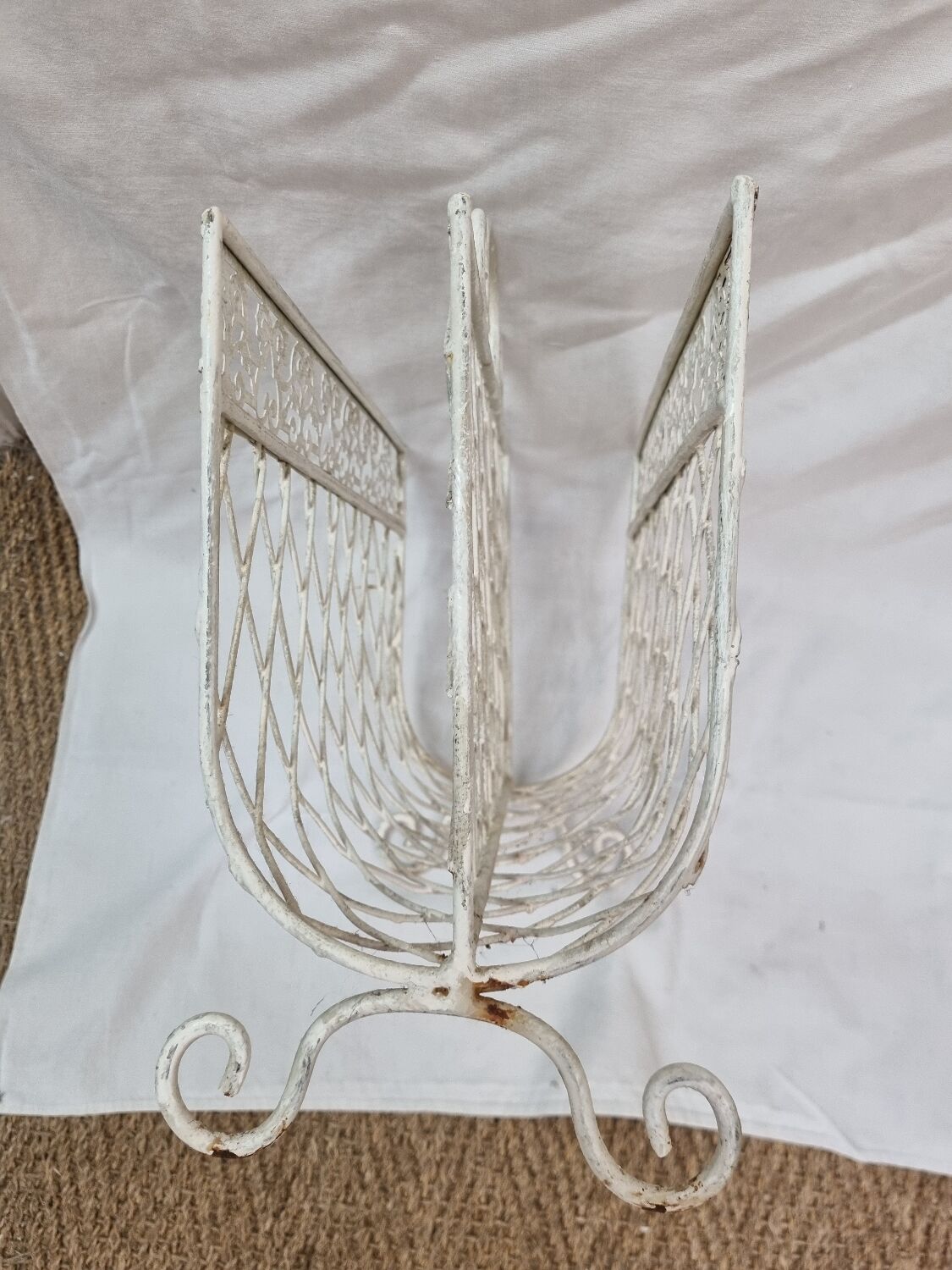 White wrought iron magazine holder
