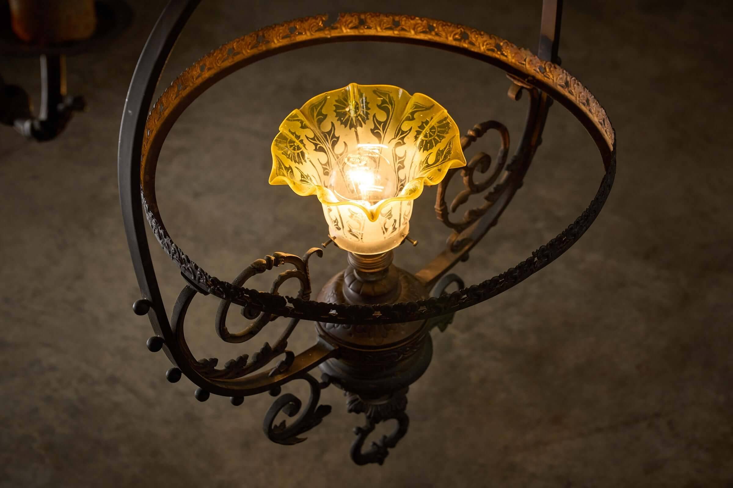 Antique adjustable height chandelier with original glasswork and brass detailing