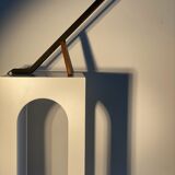 Black solid monoxyl wood bench carved into 3 arches