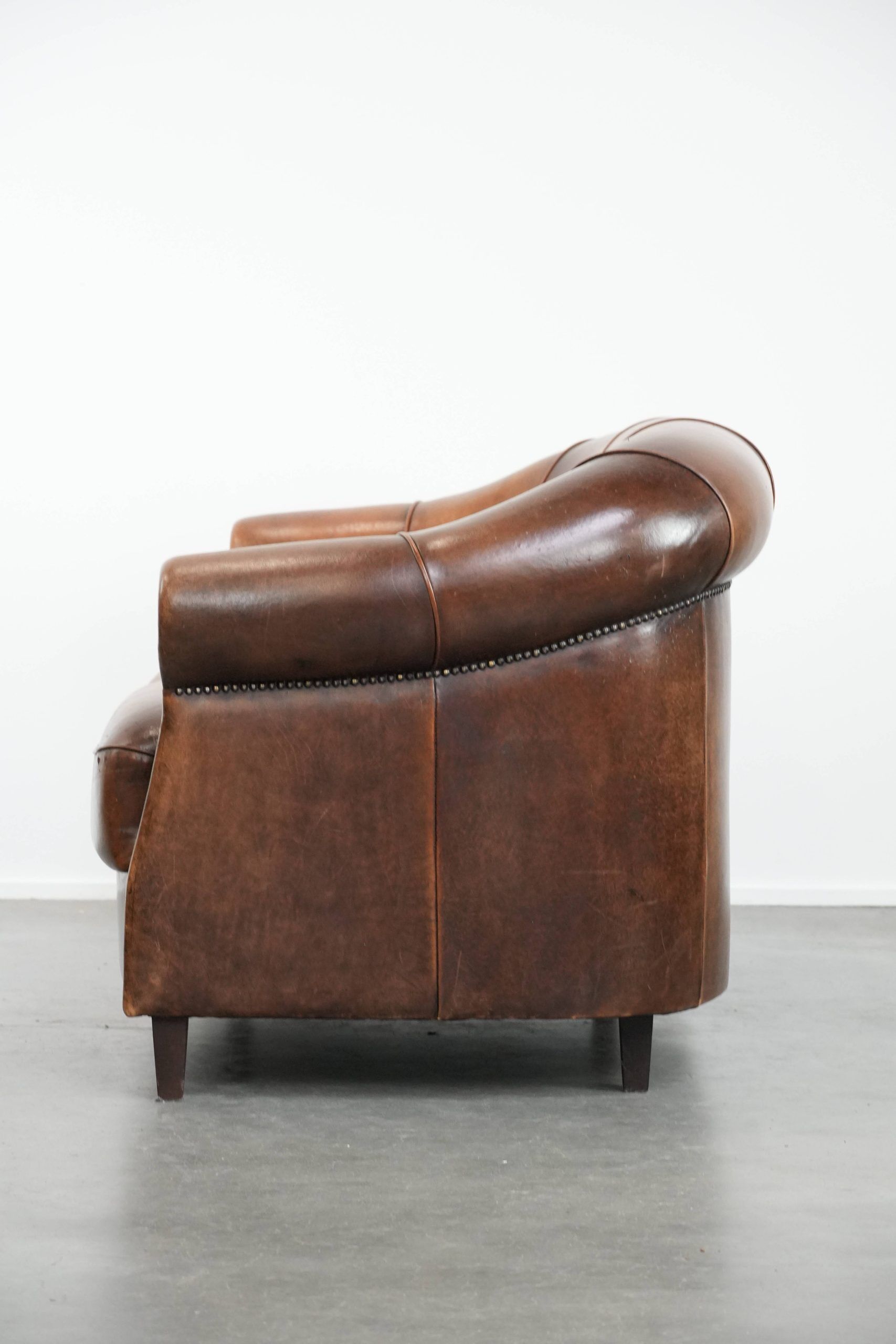 Characterful vintage sturdy 2-seater club sofa made of sheepskin leather