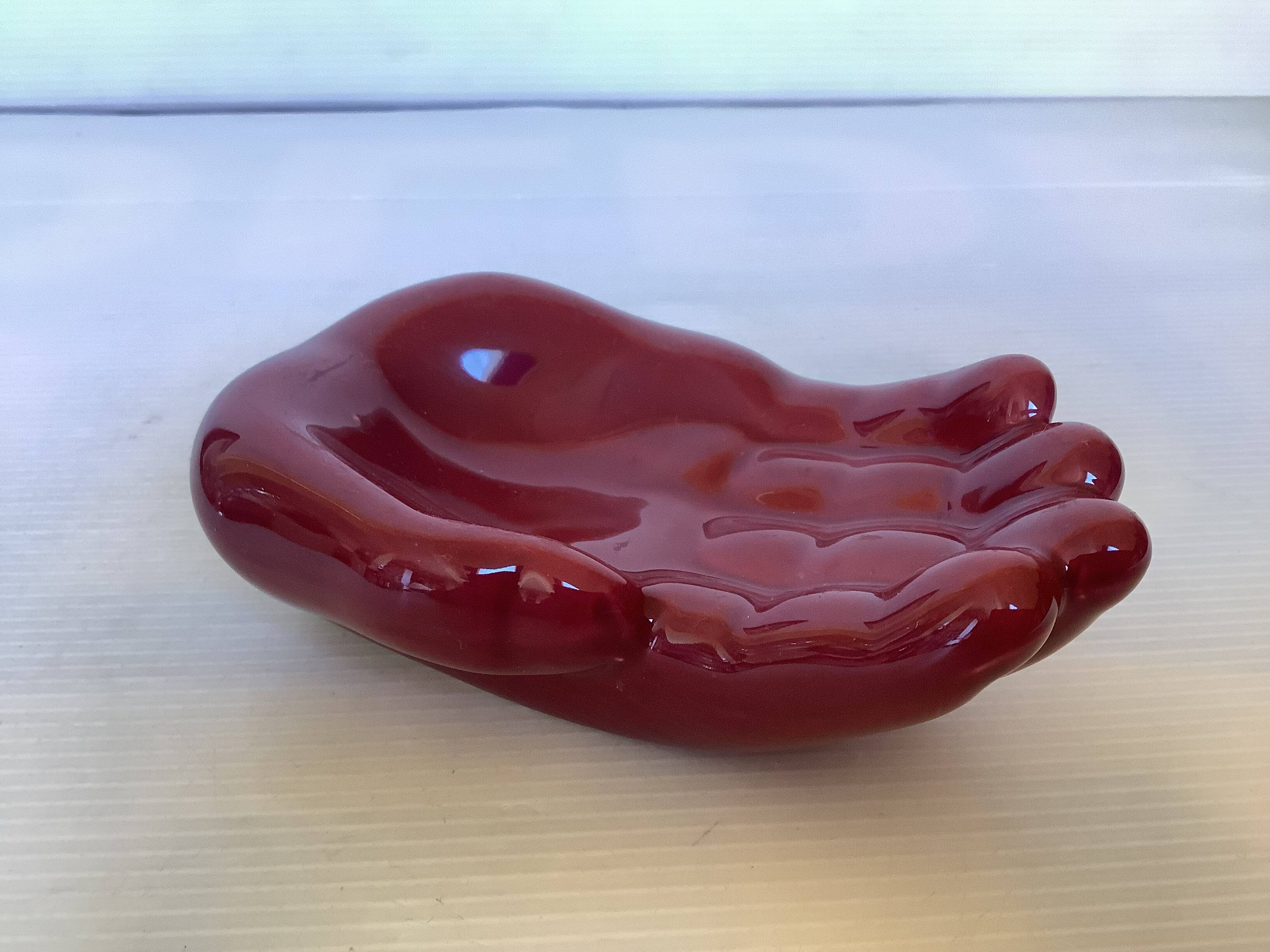 Burgundy hand emptier