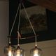Scandinavian chandelier "Cascade" from the 1960s in brass, teak, and smoked glass.