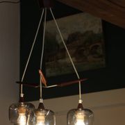 Scandinavian chandelier "Cascade" from the 1960s in brass, teak, and smoked glass.