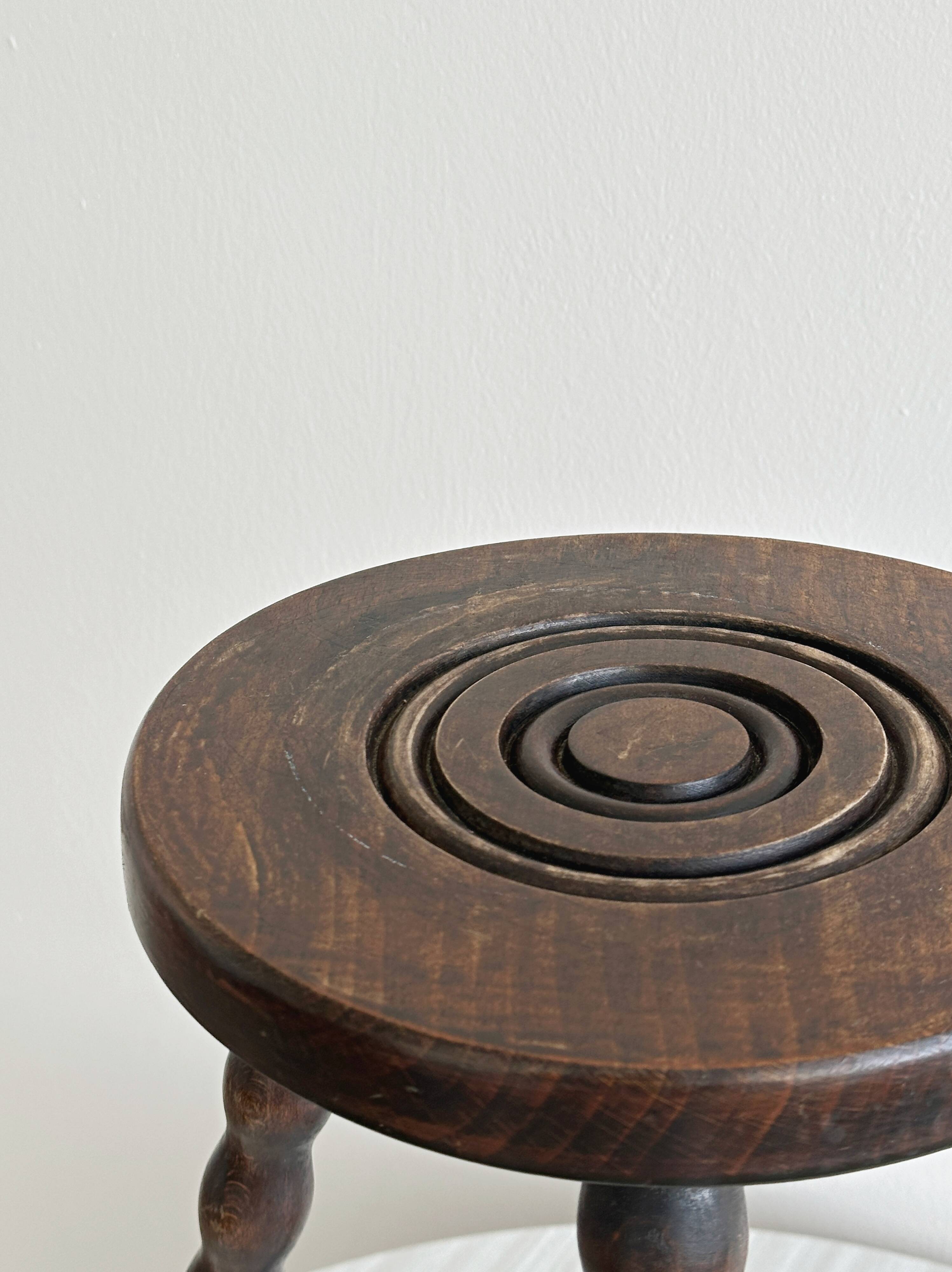 Antique three-legged twisted wooden stool