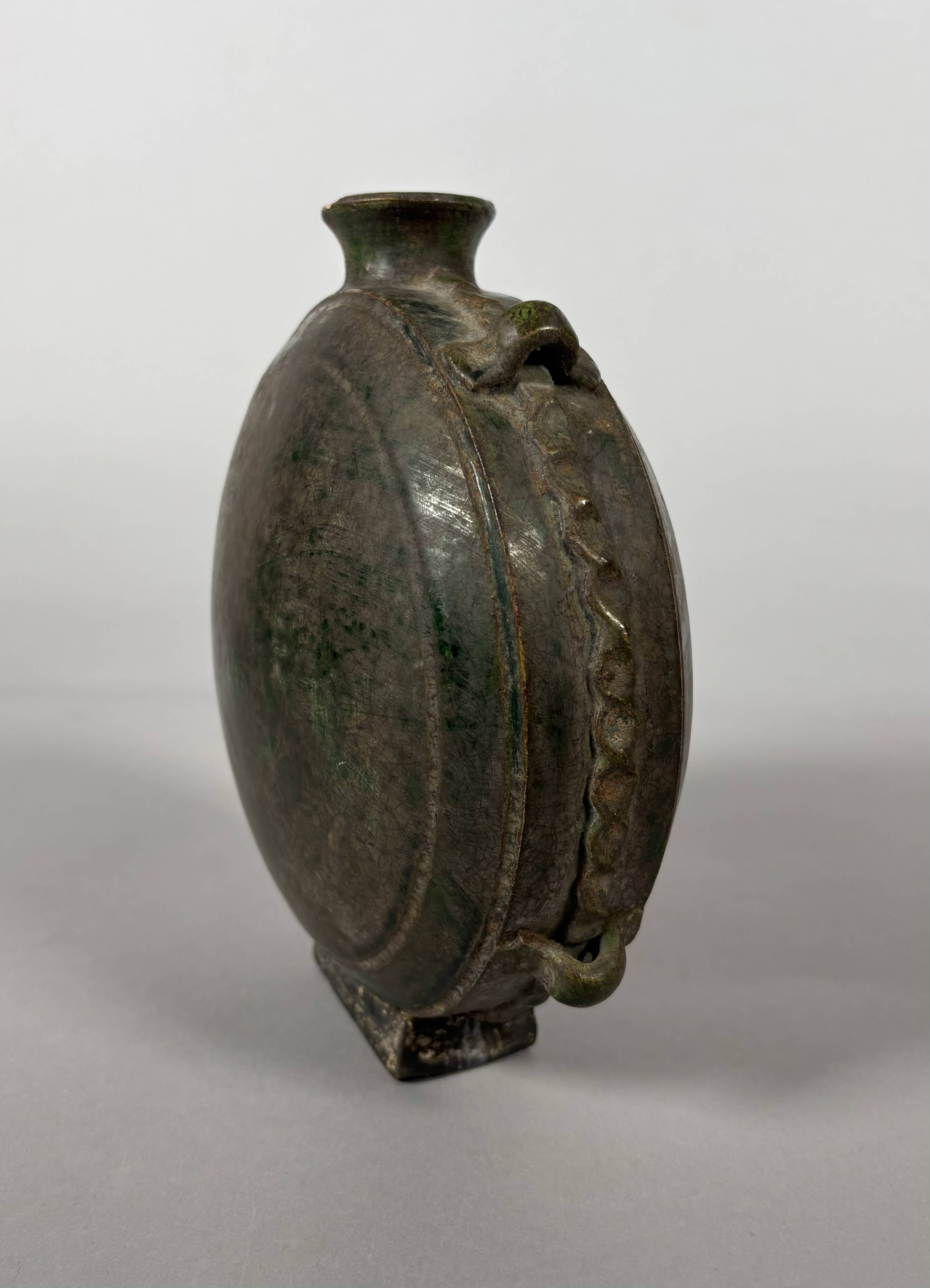 Nomadic rider's jug in green glazed earthenware, China, Tang Dynasty.