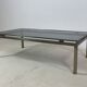 Brass coffee table with smoked glass top by Guy Lefevre, 1970s