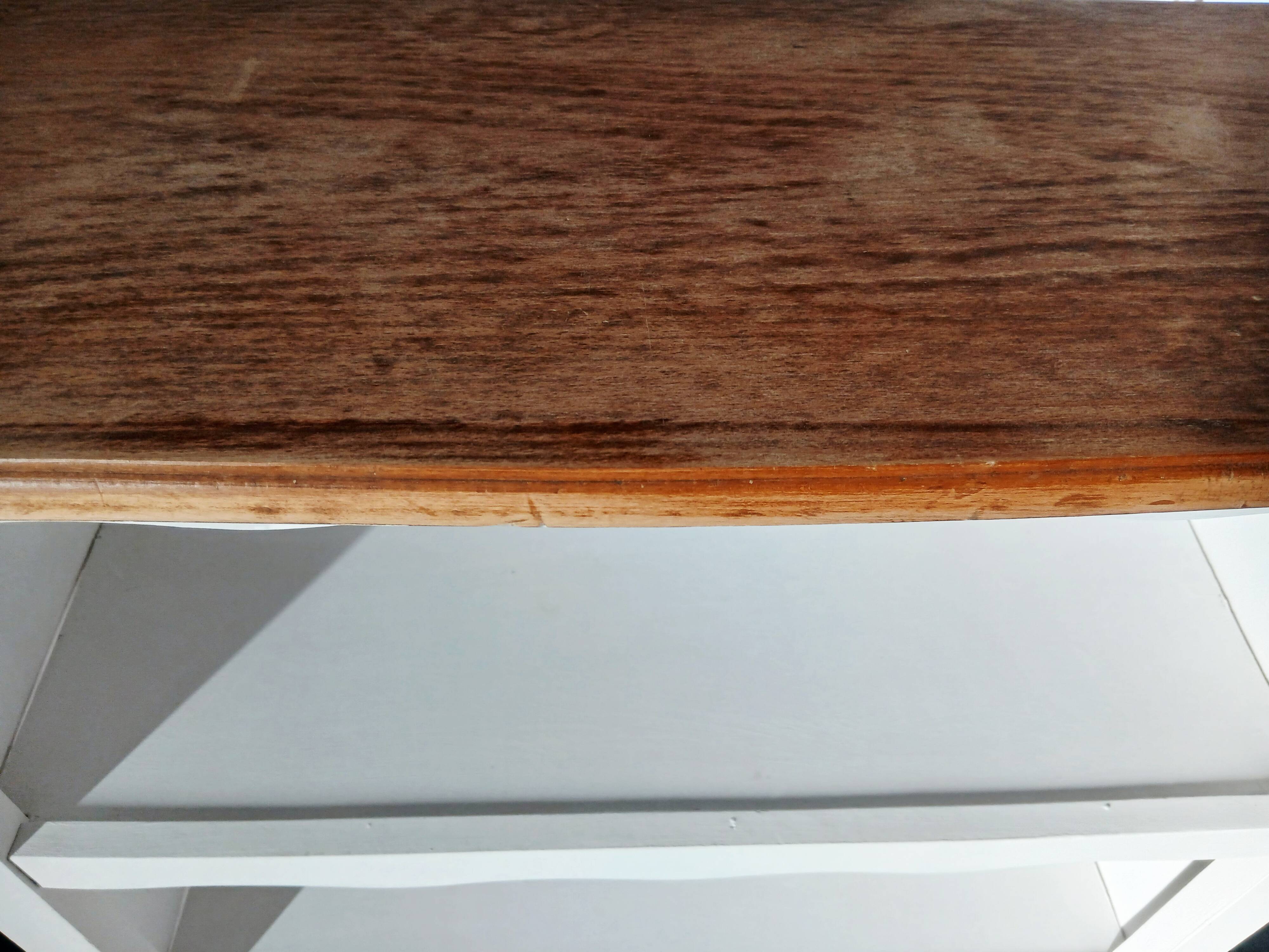 Old white bookshelf and raw wood.