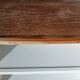 Old white bookshelf and raw wood.